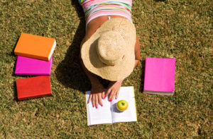 student at the grass